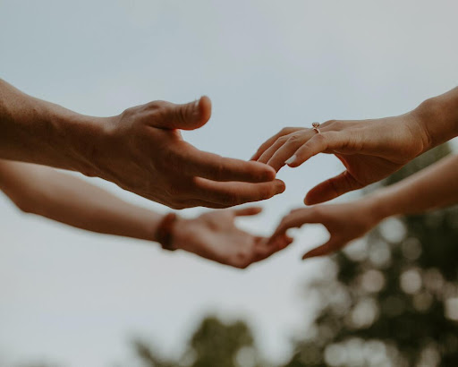 two hands touching representing physical touch in the love languages