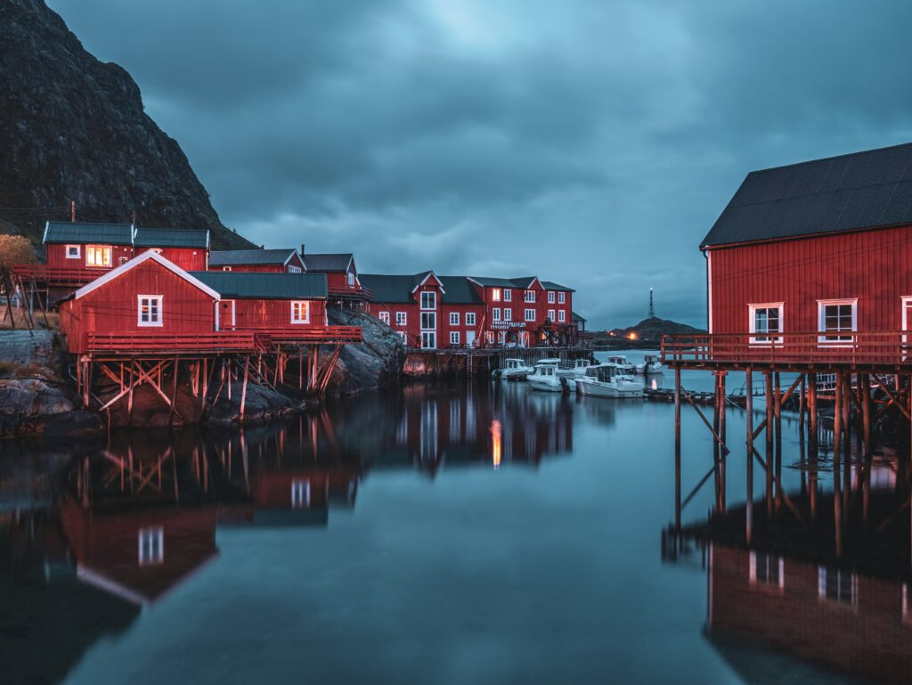 Traditional red rorbu houses in Norway, scandinavian languages comparison