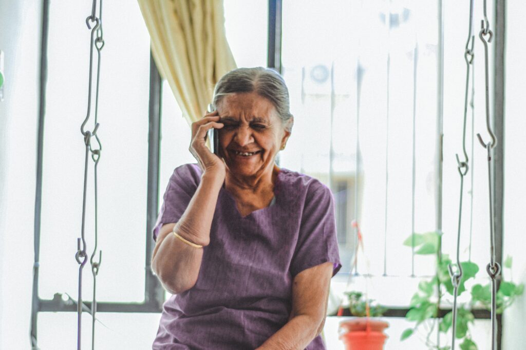 Elderly woman speaking on the phone