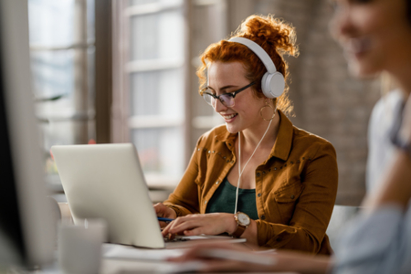 woman taking an online course on a laptop